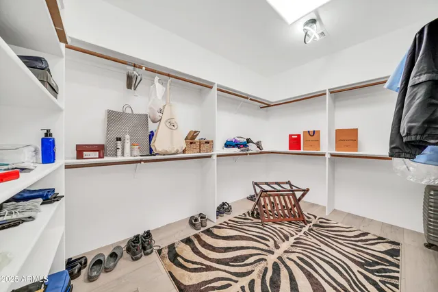 a bathroom with a granite countertop sink mirror and double
