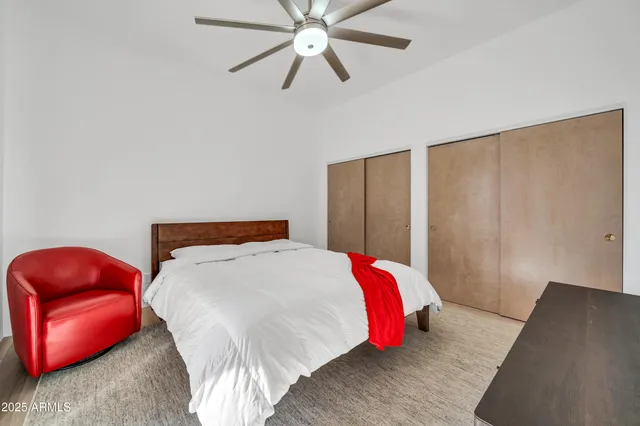 a view of a house with a yard and potted plants