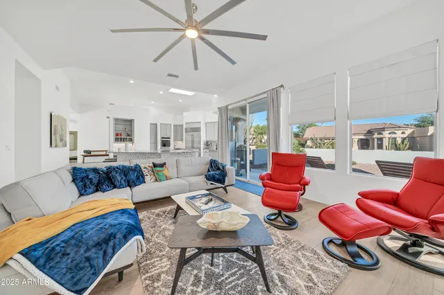 a view of a hallway with paintings on the wall