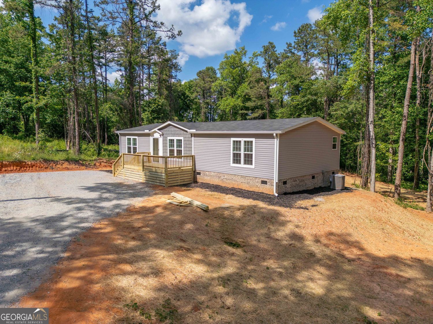 734 Hollywood Church Road Clarkesville, GA 30523 - Photo 43 of 49 a house with trees in the background