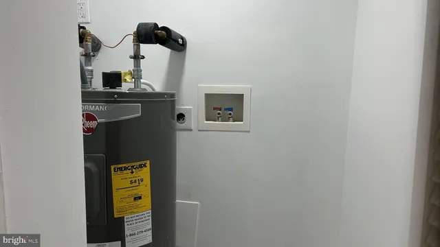 a view of an entryway with wooden floor and staircase