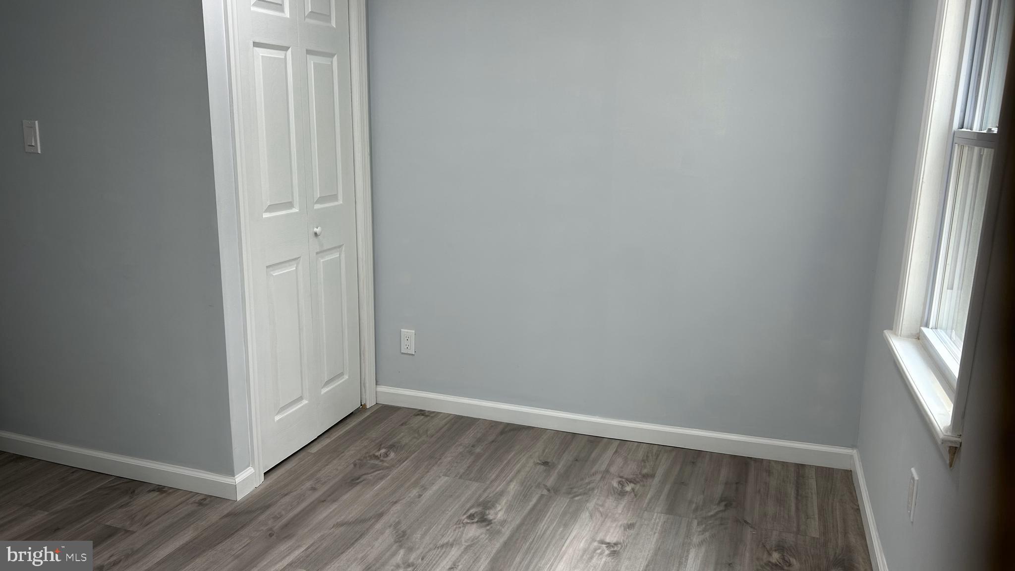 69 Carpenter Street Salem, NJ 08079 - Photo 22 of 29 a view of a hallway with wooden floor and a window