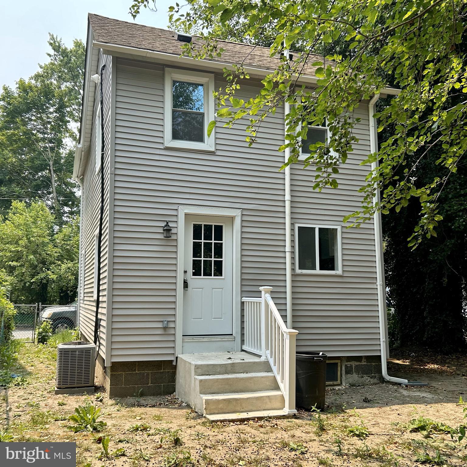 69 Carpenter Street Salem, NJ 08079 - Photo 27 of 29 a view of a house with a yard and tree in the background