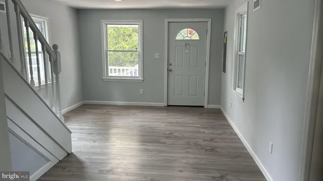 a view of entryway with wooden floor