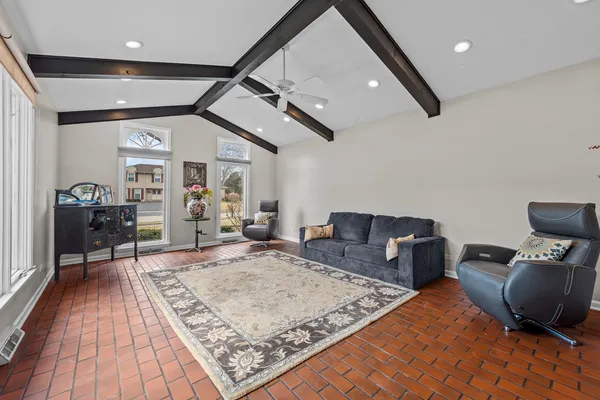 a living room with couch and a rug