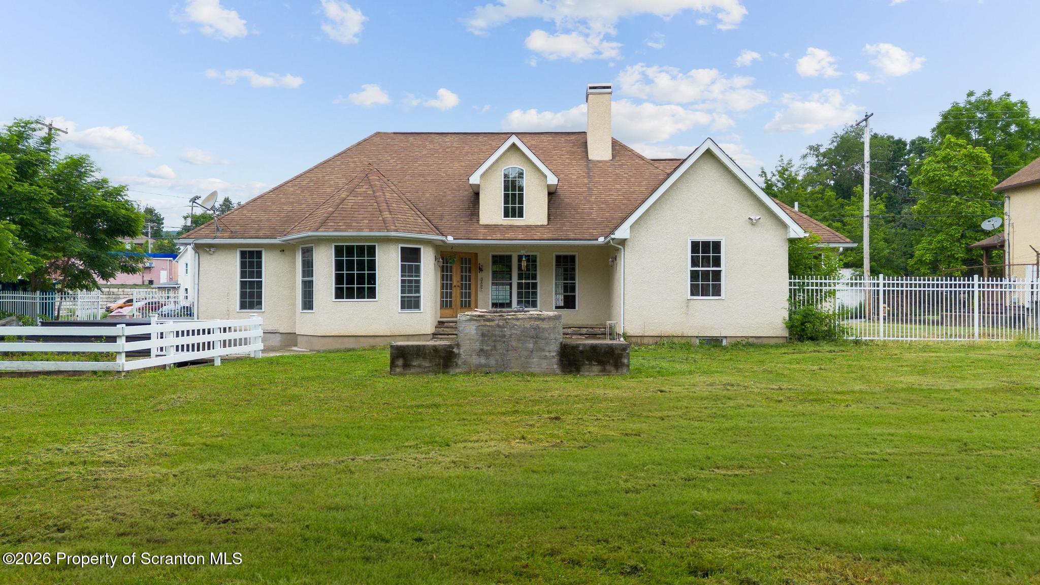 116 Forge Street Old Forge, PA 18518 - Photo 33 of 49 a front view of house with yard and outdoor seating