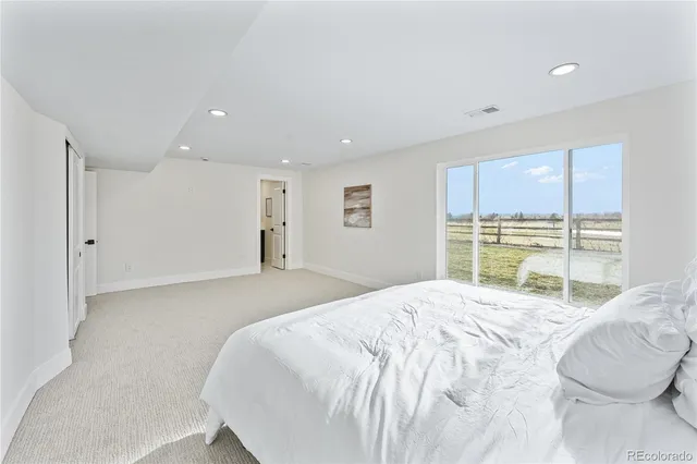 a bathroom with a shower sink and mirror