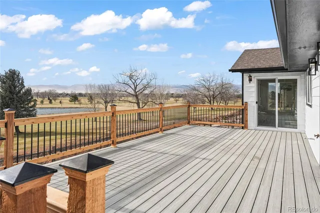 a view of a glass door with a yard from a balcony