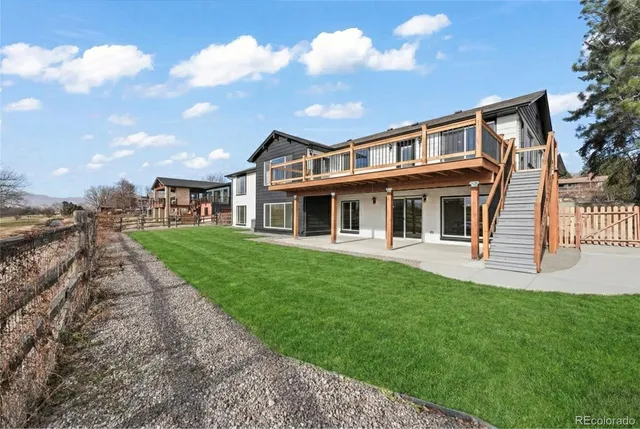 a view of a roof deck with large trees