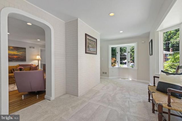 an empty room with furniture and windows