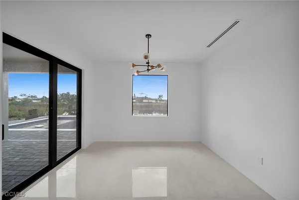 a view of a room with large windows