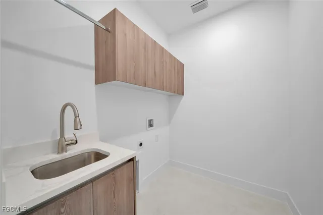 a kitchen with a sink and cabinets