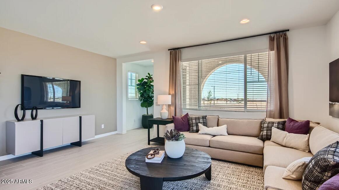 16433 West Weeping Willow Road Surprise, AZ 85387 - Photo 10 of 22 a living room with furniture and a large window