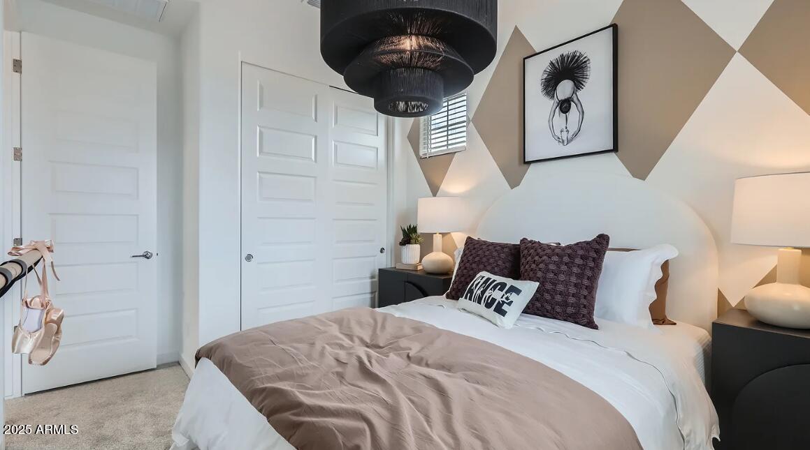 16433 West Weeping Willow Road Surprise, AZ 85387 - Photo 16 of 22 a bedroom with a bed and painting on the wall