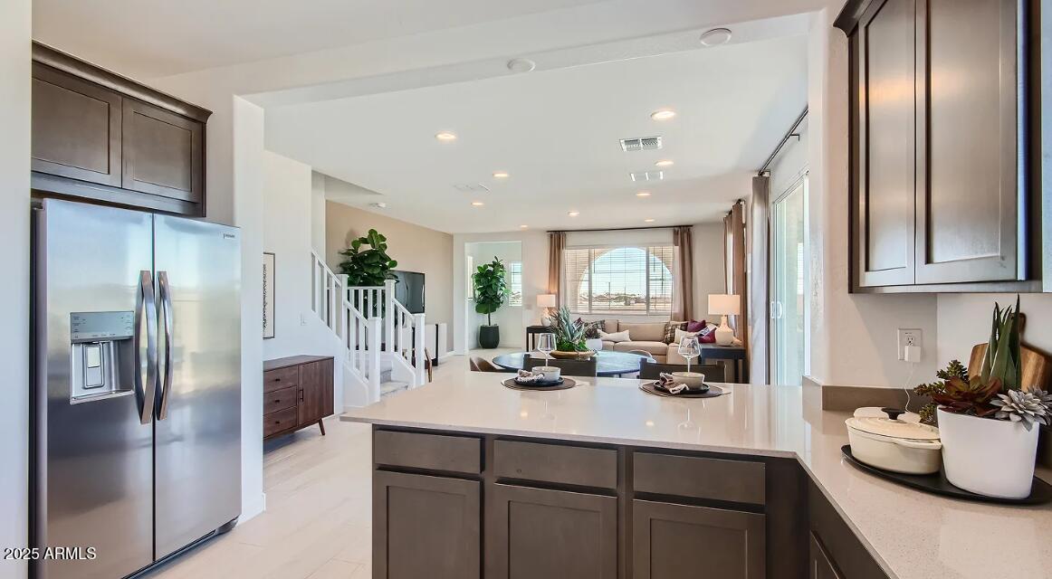 16433 West Weeping Willow Road Surprise, AZ 85387 - Photo 4 of 22 a kitchen with stainless steel appliances granite countertop a refrigerator and a sink
