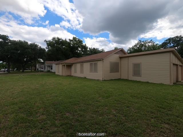 4200 Culpepper Drive Bryan, TX 77801 - Photo 2 of 18 a view of a backyard with grass and a large tree