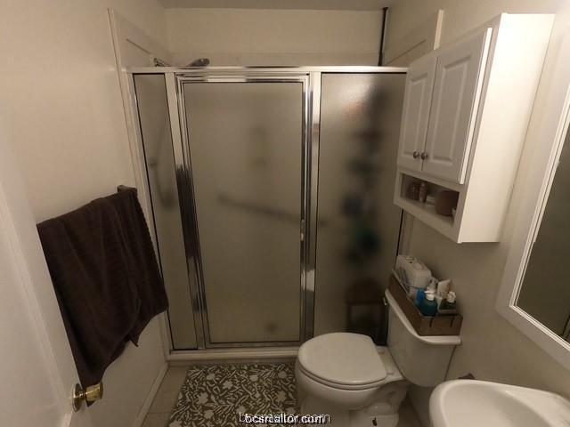 4200 Culpepper Drive Bryan, TX 77801 - Photo 8 of 18 a bathroom with a toilet and a shower