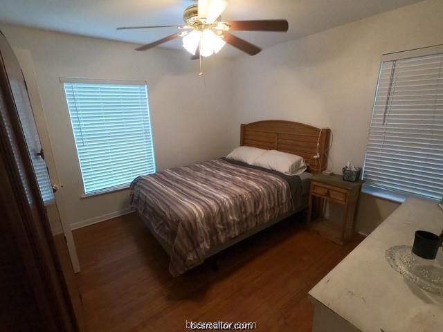 4200 Culpepper Drive Bryan, TX 77801 - Photo 9 of 18 a bedroom with a bed and a flat tv screen on the dresser