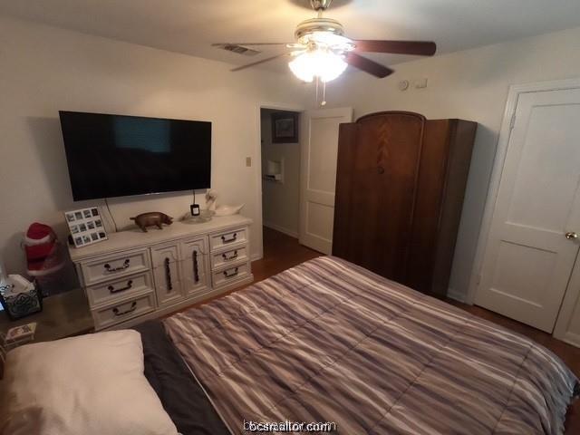 4200 Culpepper Drive Bryan, TX 77801 - Photo 10 of 18 a bedroom with a bed and a flat screen tv