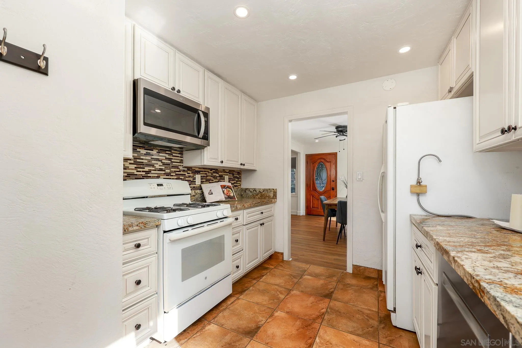 2146 El Pasillo Lane Spring Valley, CA 91977 - Photo 11 of 30 a kitchen with stainless steel appliances granite countertop a stove and a sink