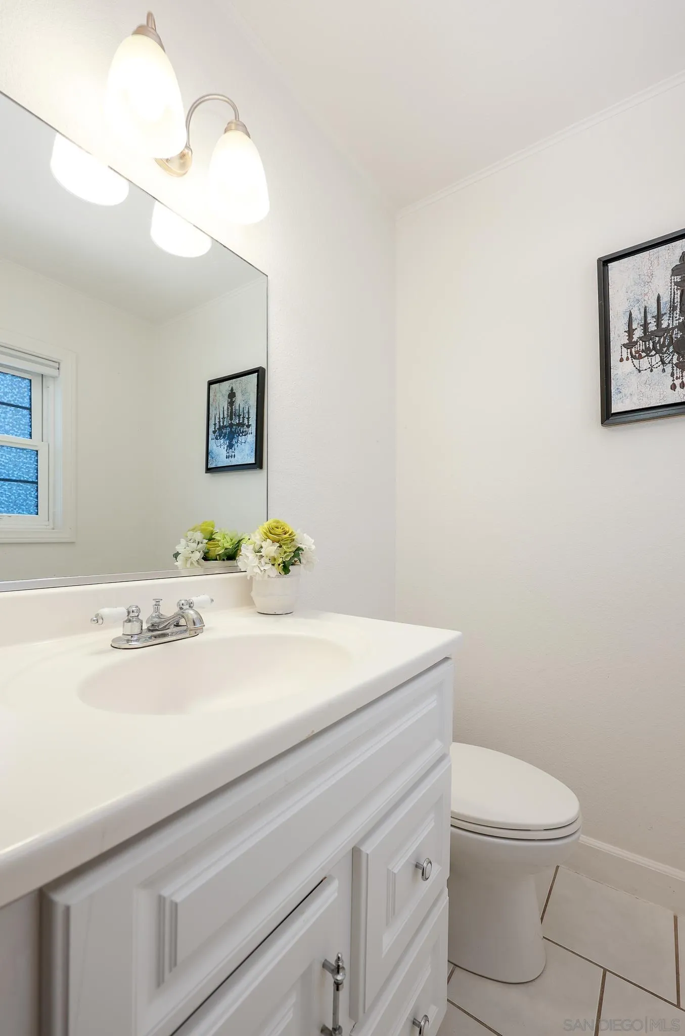 2146 El Pasillo Lane Spring Valley, CA 91977 - Photo 14 of 30 a bathroom with a sink a toilet and mirror