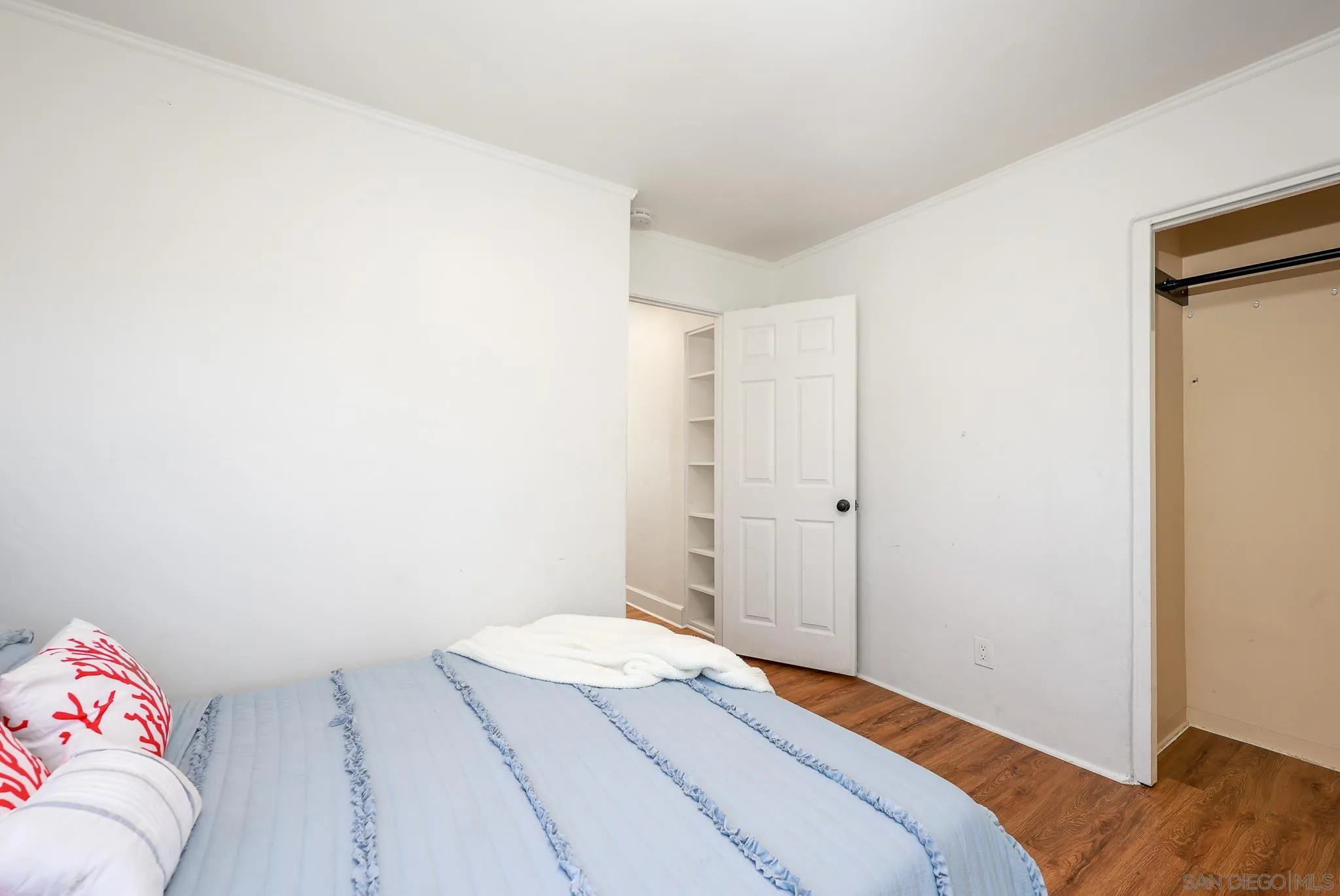 2146 El Pasillo Lane Spring Valley, CA 91977 - Photo 16 of 30 a bedroom with a bed and hallway