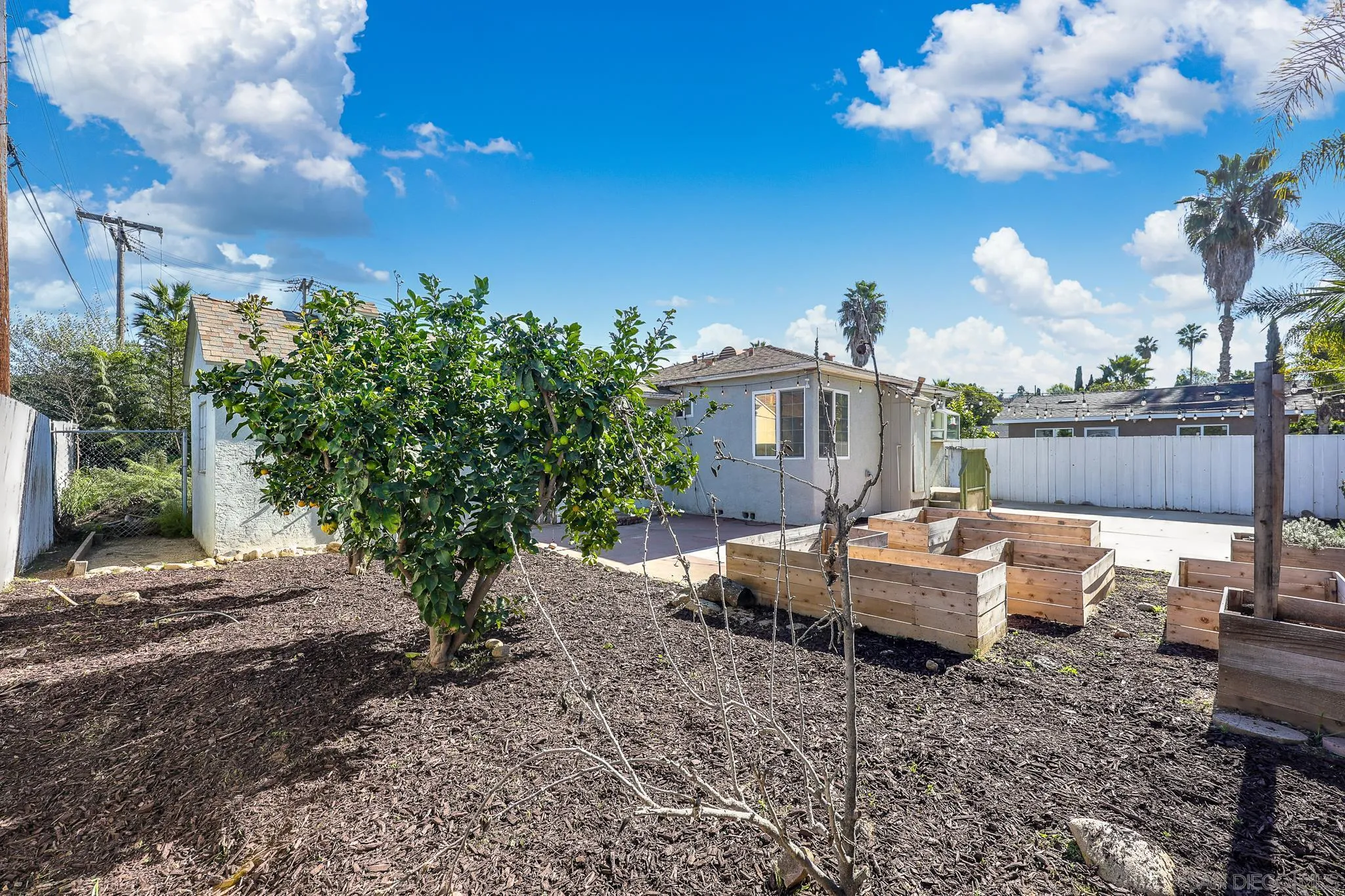 2146 El Pasillo Lane Spring Valley, CA 91977 - Photo 20 of 30 a view of a house with backyard and sitting area