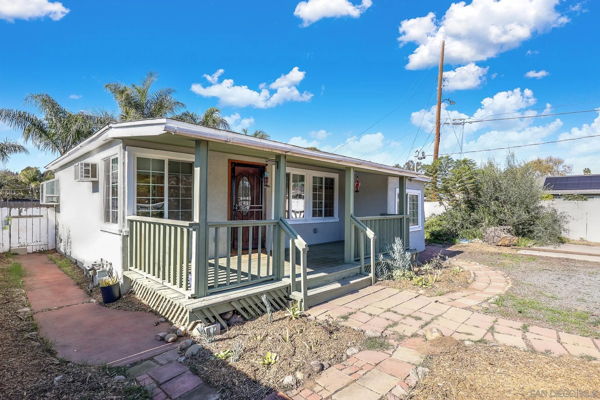 2146 El Pasillo Lane Spring Valley, CA 91977 - Photo 22 of 30 a view of a house with a wooden fence