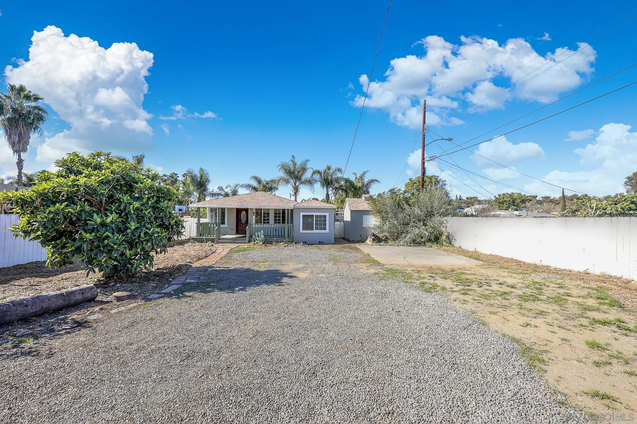 2146 El Pasillo Lane Spring Valley, CA 91977 - Photo 27 of 30 a front view of a house with a yard and a fountain