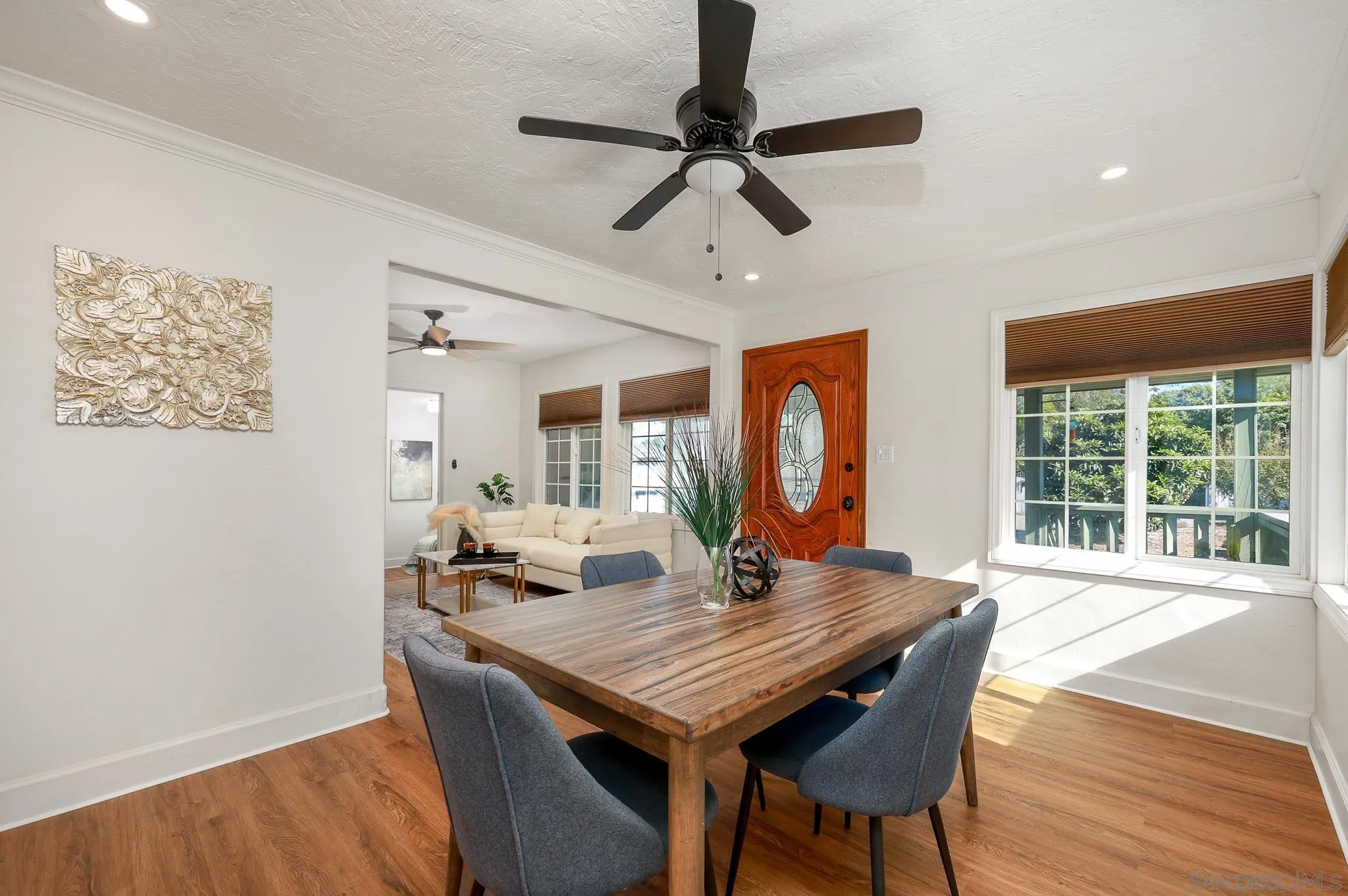 2146 El Pasillo Lane Spring Valley, CA 91977 - Photo 6 of 30 a view of a dining room with furniture window and wooden floor