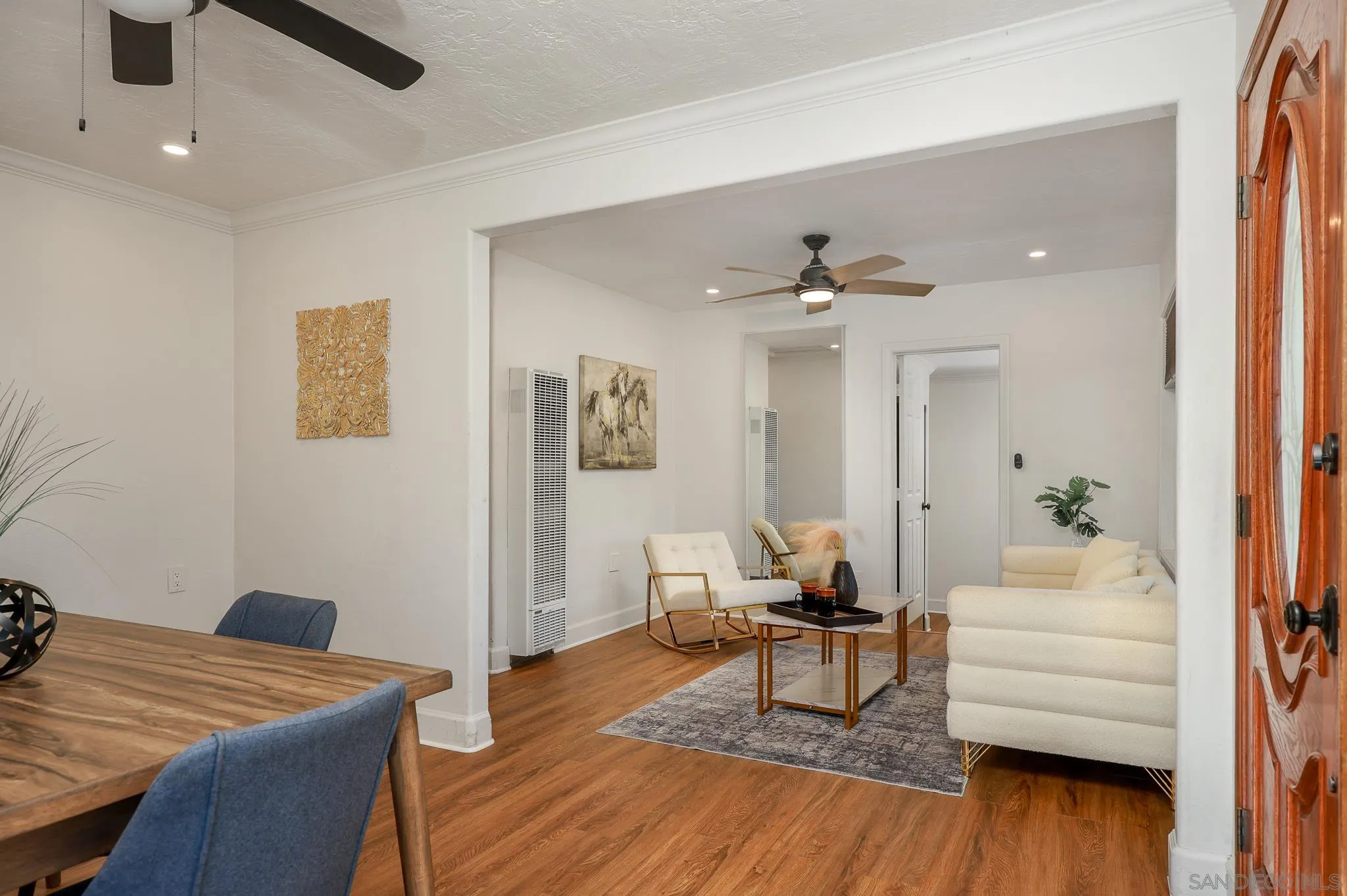 2146 El Pasillo Lane Spring Valley, CA 91977 - Photo 8 of 30 a living room with furniture and wooden floor