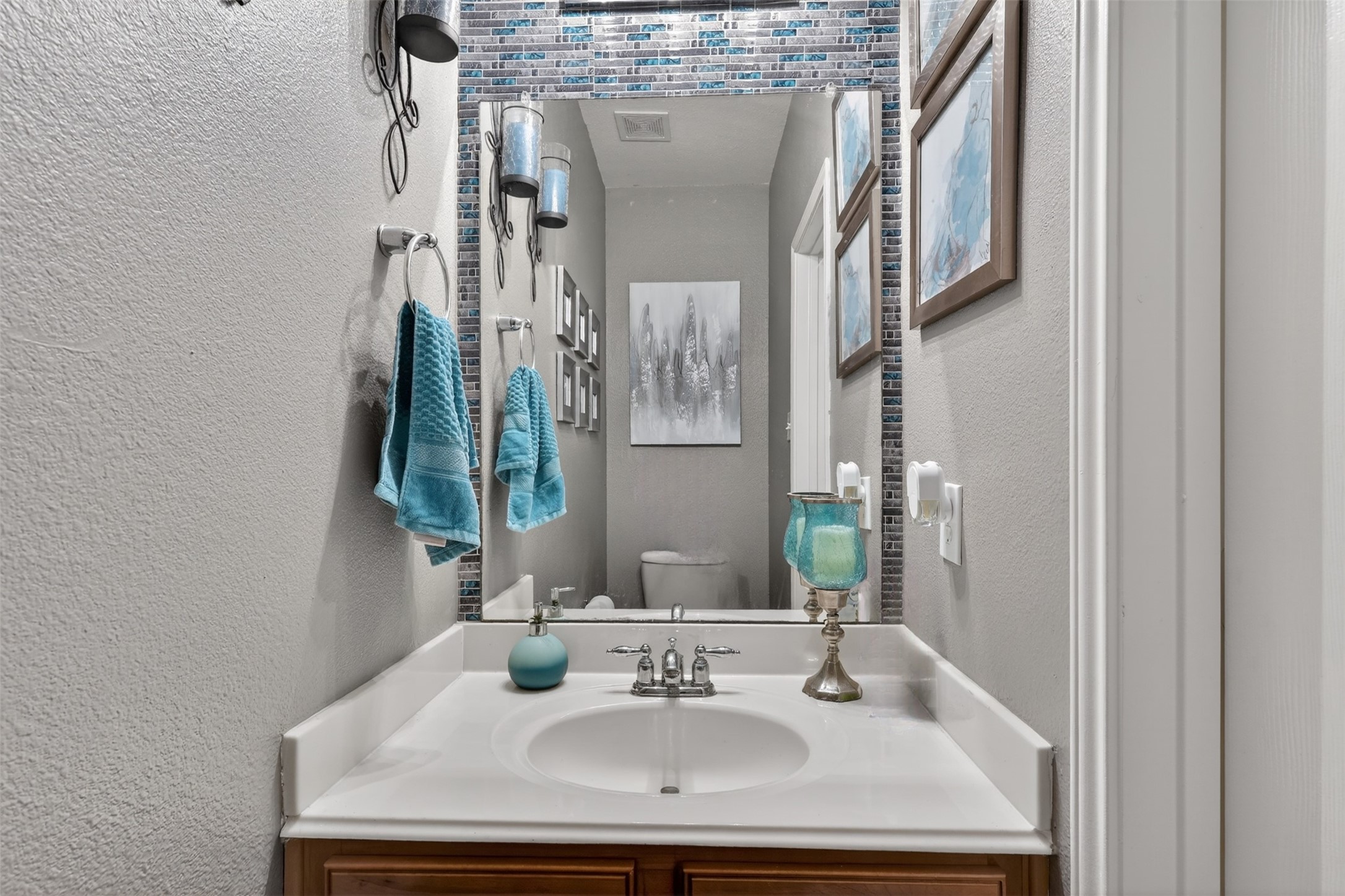 25710 Crisp Spring Lane Spring, TX 77373 - Photo 15 of 37 Half Bathroom (Powder Room)
Stylish powder bath featuring a modern framed mirror, decorative tile accent, and fresh neutral tones—perfectly positioned for guests.