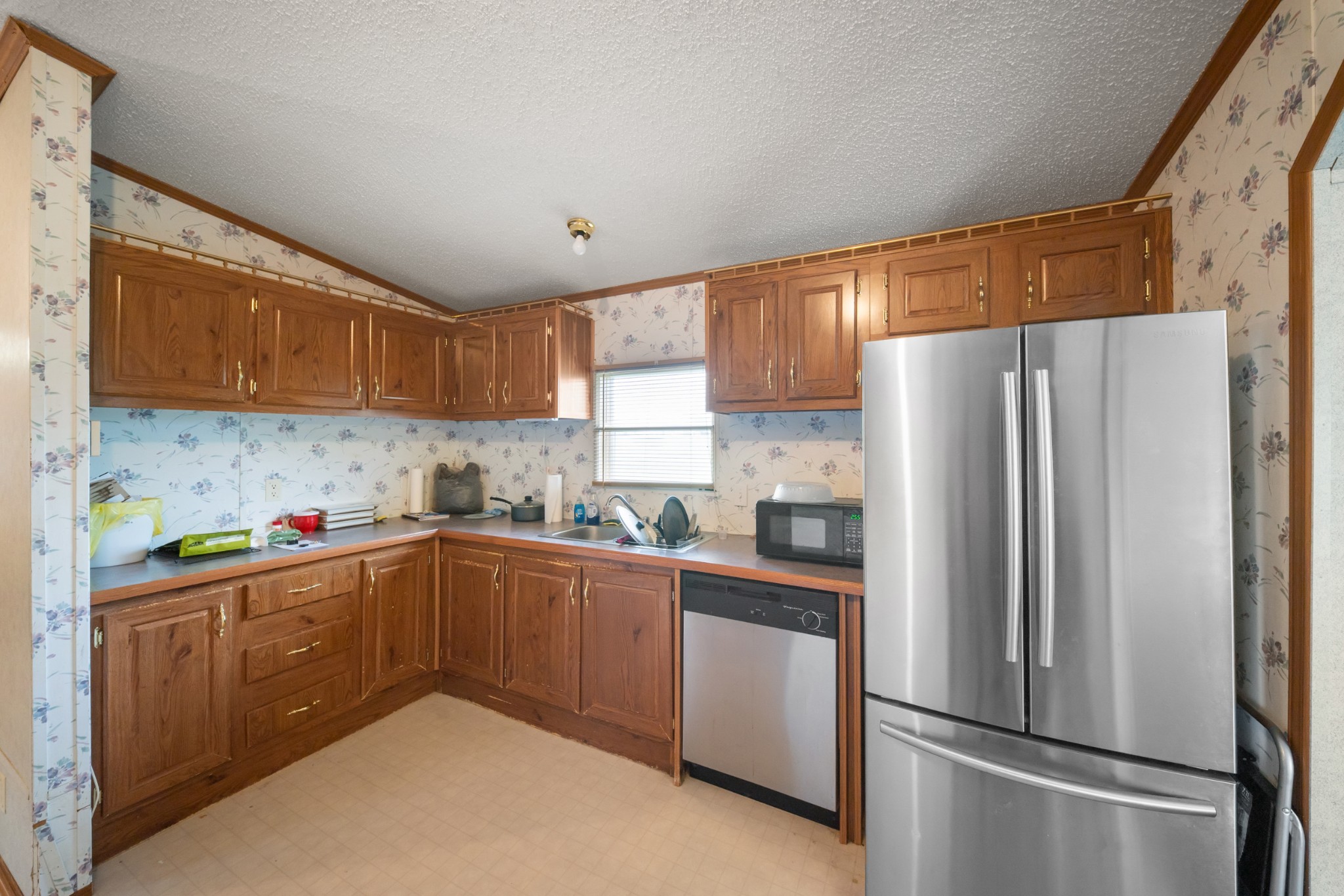 1777 Pond River Road Elkton, KY 42220 - Photo 10 of 21 a kitchen with stainless steel appliances a refrigerator sink and cabinets