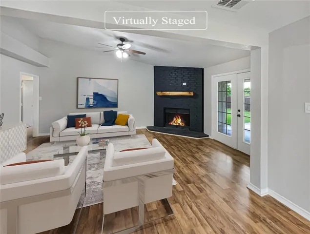 a living room with furniture and a fireplace