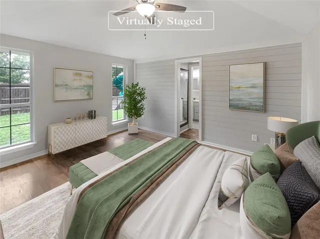 a spacious bedroom with a bed and a couch