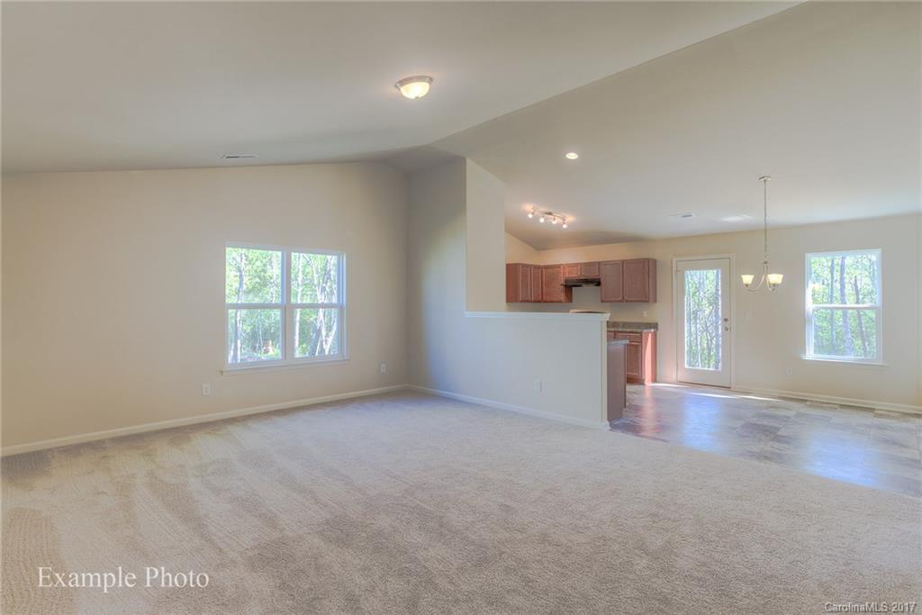 2119 Gunnars Ridge Road, Unit 17 Lancaster, SC 29720 - Photo 13 of 24 an empty room with wooden floor and windows