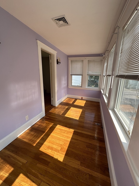 17 Herbert Road, Unit 1 Arlington, MA 02474 - Photo 16 of 26 a view of a room with wooden floor