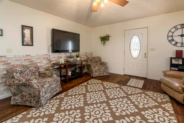 a living room with couch and a flat screen tv