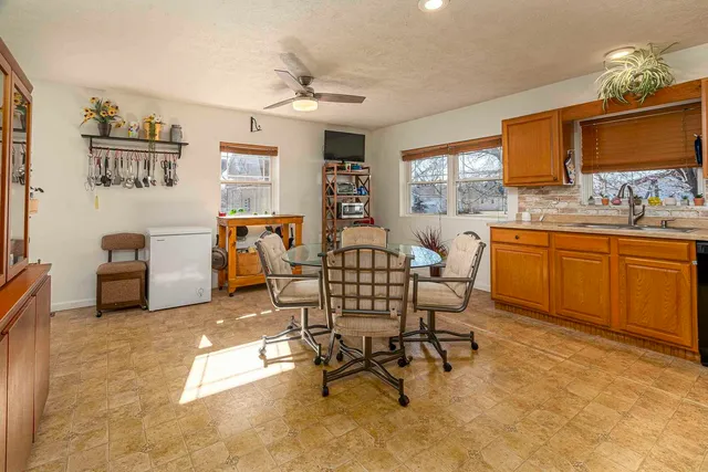a dining room with furniture and window
