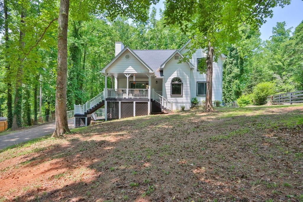 a front view of a house with a garden