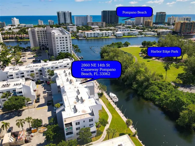 a view of a swimming pool outdoor seating and a patio