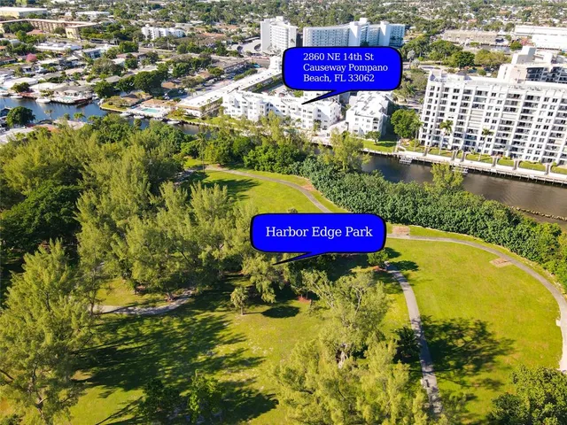 a view of swimming pool with a red umbrella