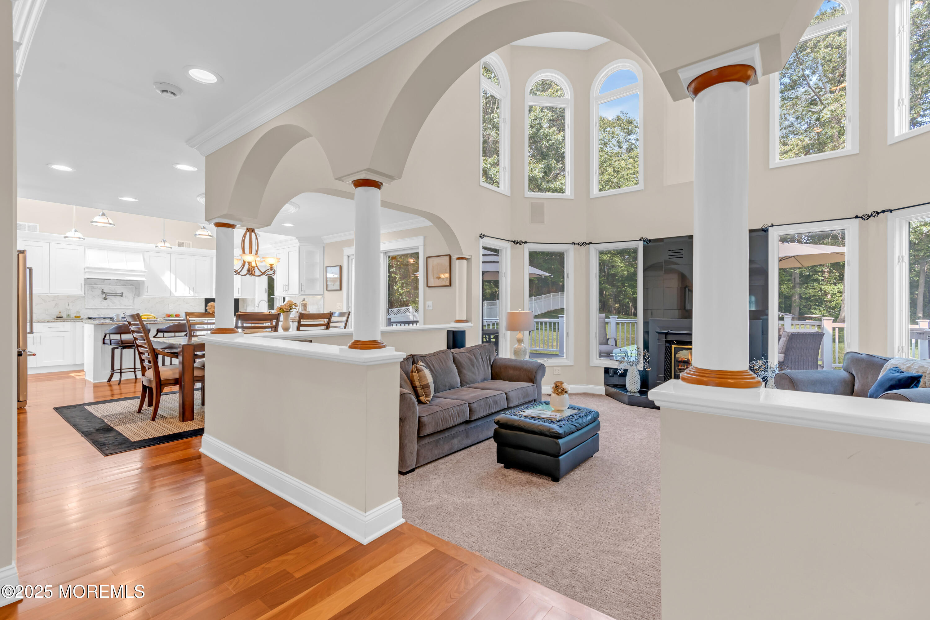 102 Greenwood Road Morganville, NJ 07751 - Photo 2 of 11 a living room with fireplace furniture and a large window