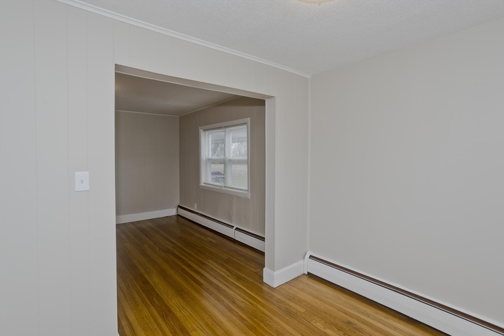 177 Marion Street Chicopee, MA 01013 - Photo 26 of 36 a view of an empty room and wooden floor