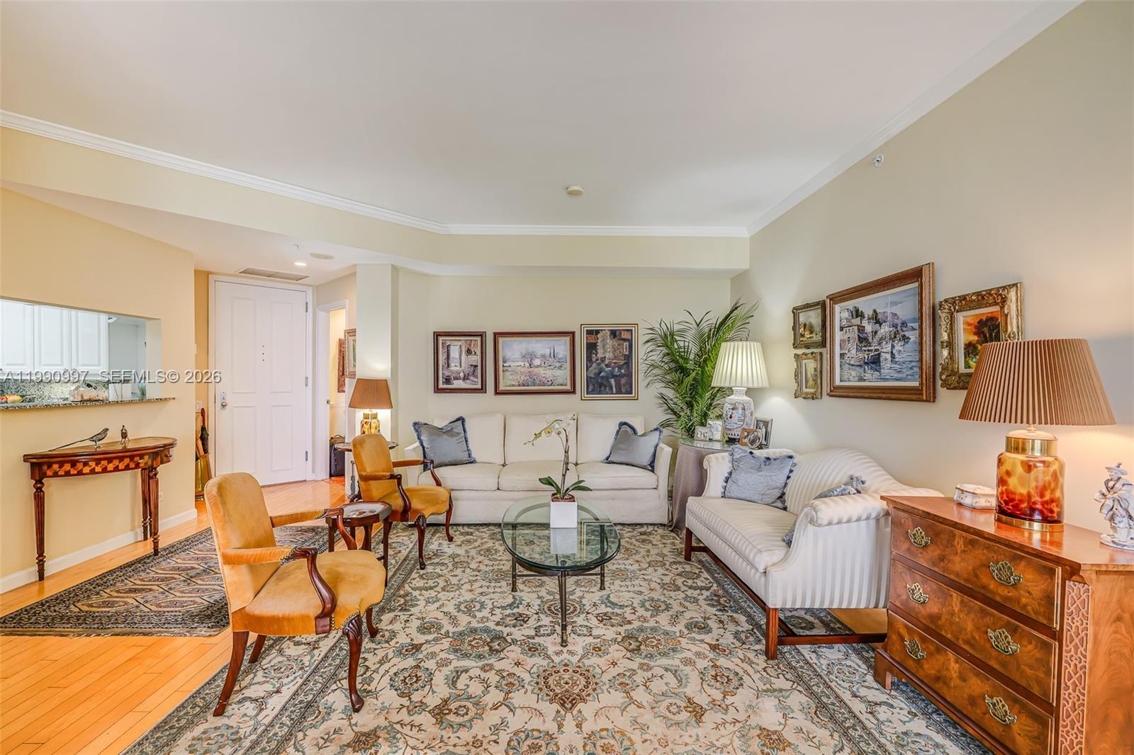 888 Brickell Key Drive, Unit 807 Miami, FL 33131 - Photo 12 of 62 a living room with furniture and wooden floor