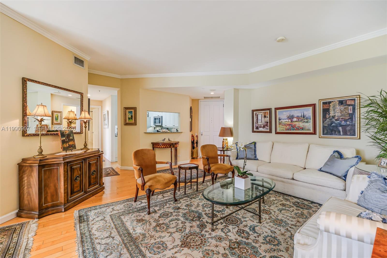 888 Brickell Key Drive, Unit 807 Miami, FL 33131 - Photo 13 of 62 a living room with furniture a rug and a table