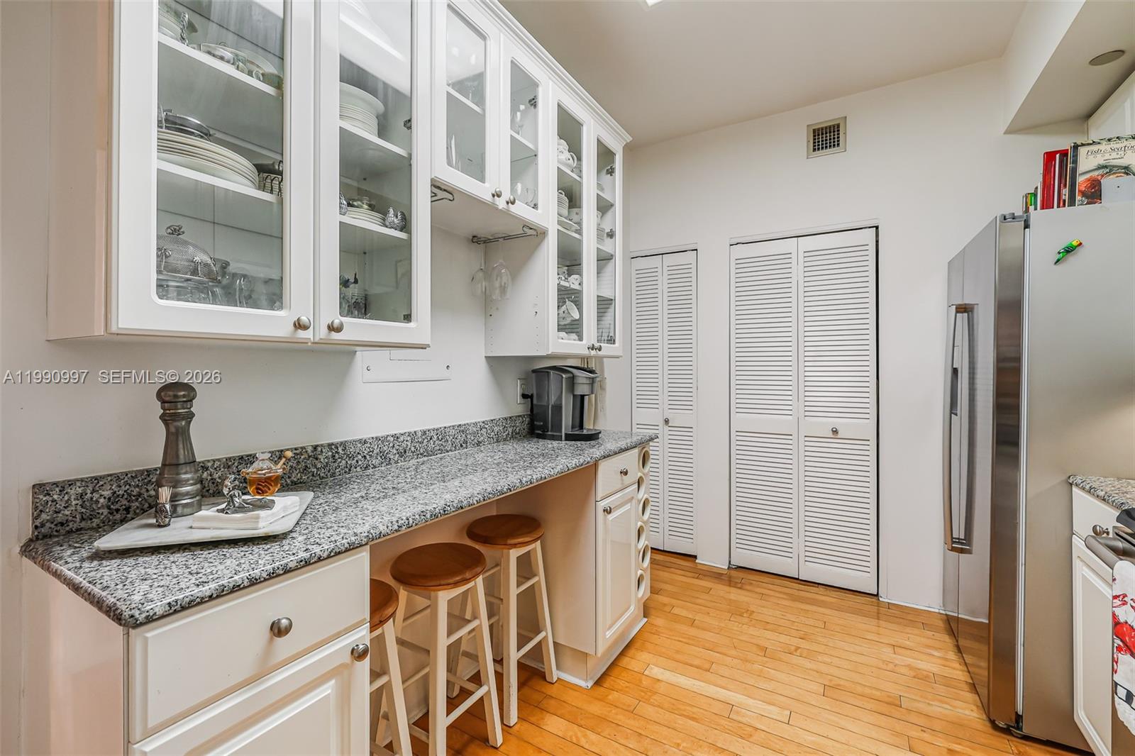 888 Brickell Key Drive, Unit 807 Miami, FL 33131 - Photo 23 of 62 a kitchen with stainless steel appliances granite countertop a sink and a refrigerator