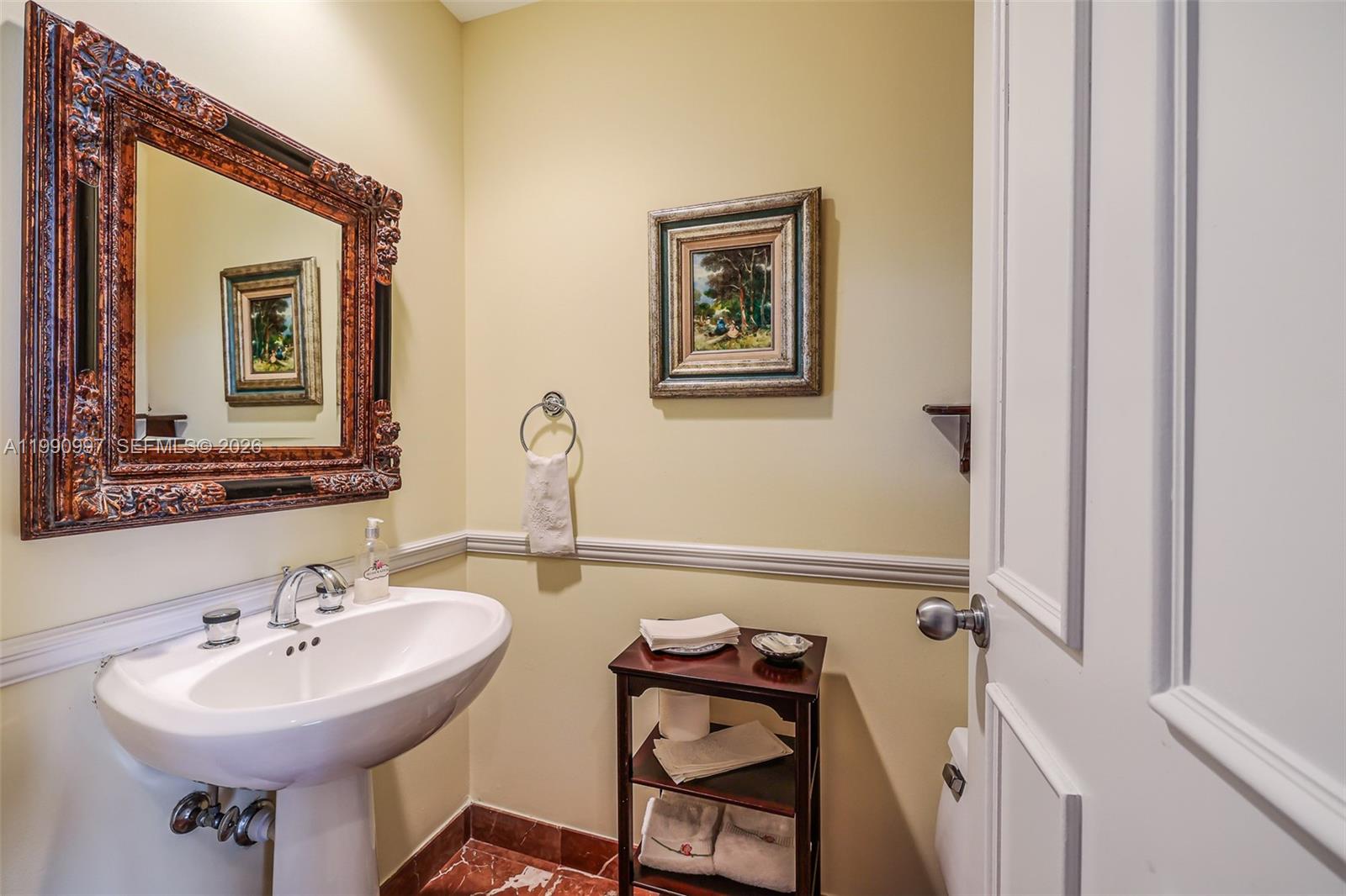 888 Brickell Key Drive, Unit 807 Miami, FL 33131 - Photo 24 of 62 a bathroom with a sink a mirror and a toilet