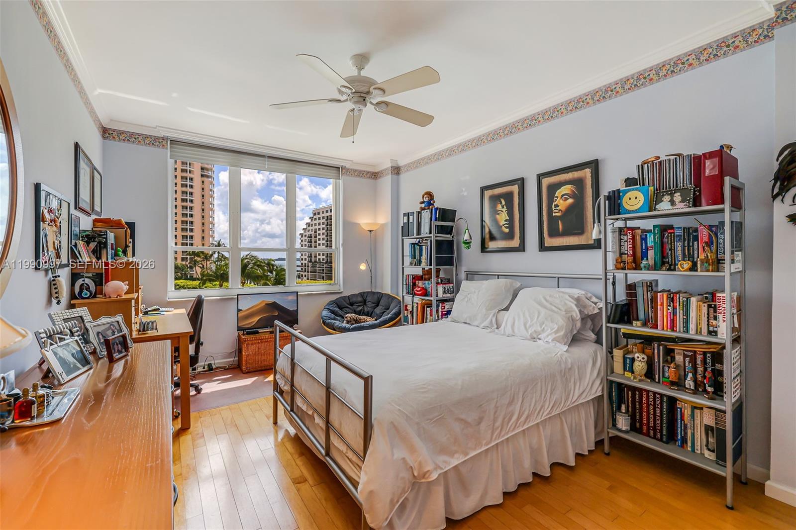 888 Brickell Key Drive, Unit 807 Miami, FL 33131 - Photo 25 of 62 a bedroom with a bed furniture and a large window