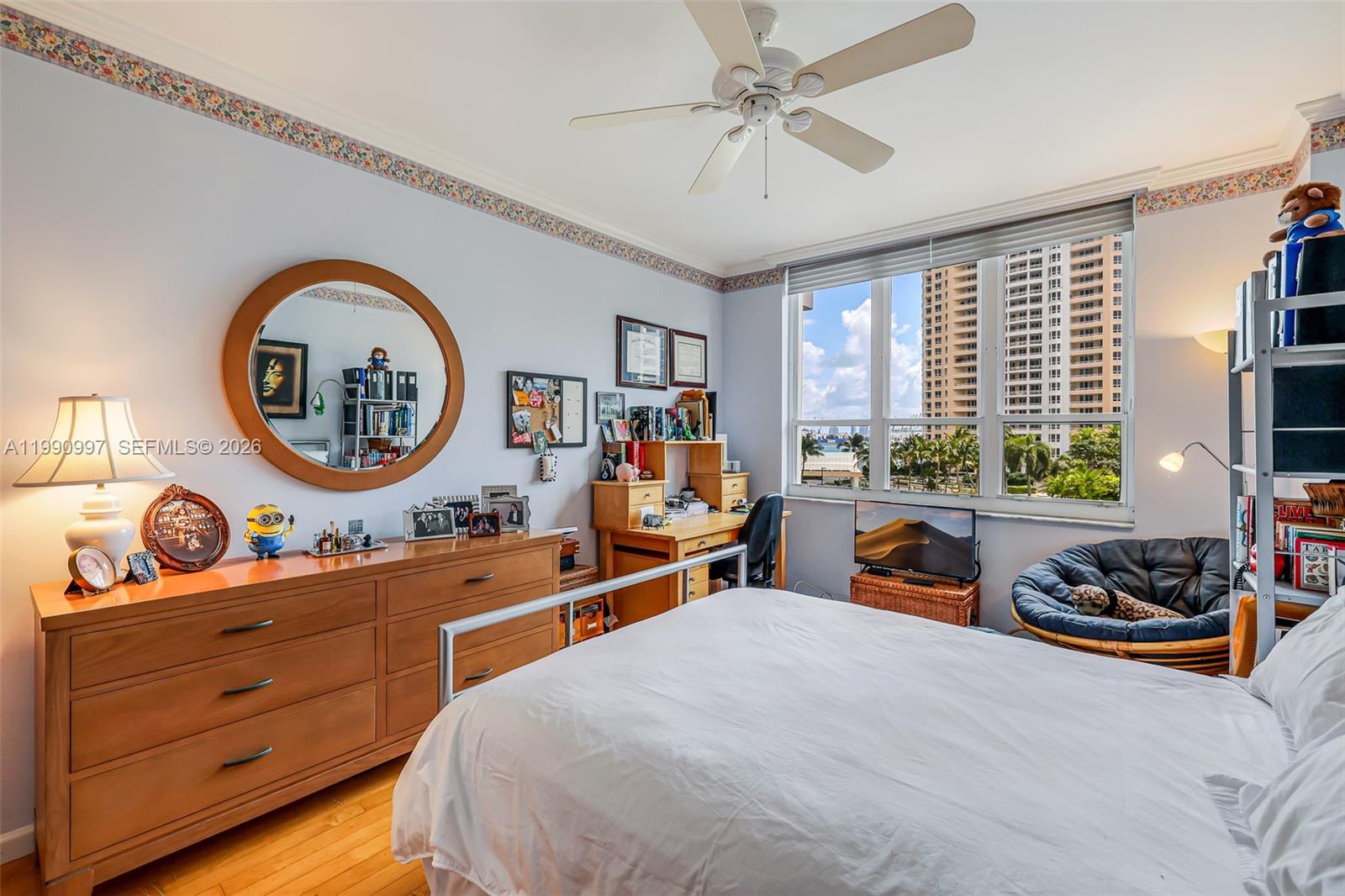 888 Brickell Key Drive, Unit 807 Miami, FL 33131 - Photo 26 of 62 a bed room with a bed and a large window